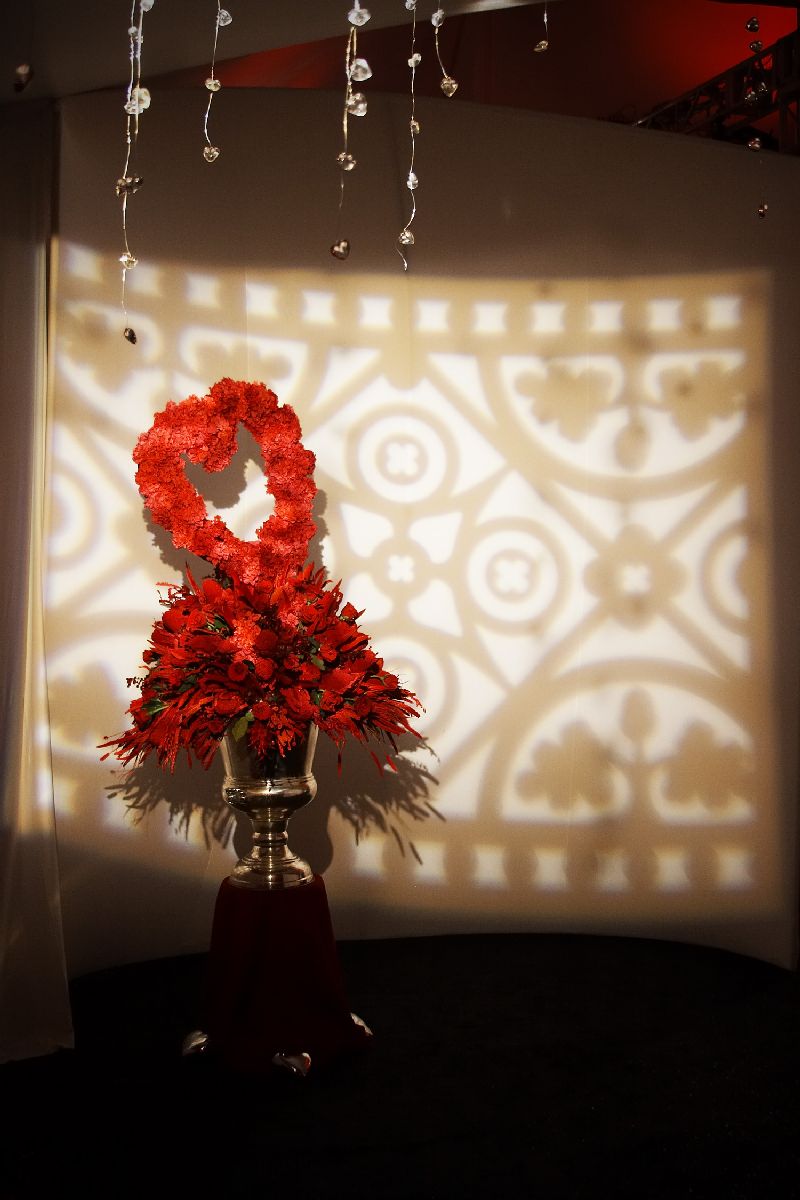 Dramatic floral and custom lighting created a bold entry into the tent. 