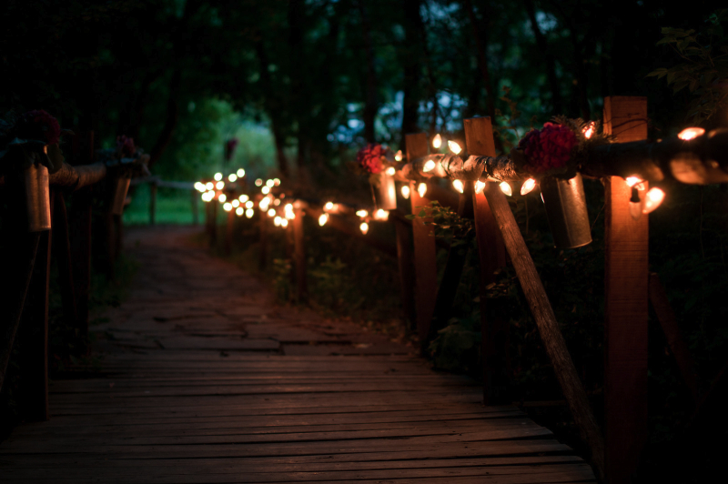 a-lighted-walkway-over-a-creek-on-the-organic-farm-wm-events