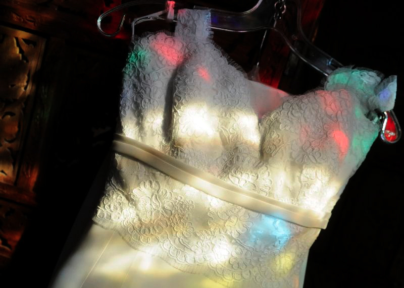 wedding-dress-illuminated-by-the-churchs-stained-glass-windows