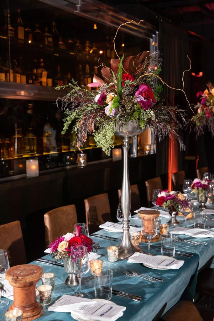 wm events, private dinner, private events, kr steakbar, floral designer, floral design, lush florals, dark and moody, red florals, red flowers, tall centerpieces, tall flower arrangements, tall floral arrangements, tablescapes, velvet linen, nbc, nbcuniversal, super bowl dinner, atlanta event planner, atlanta events, georgia events, event planning, event designer, event designing, corporate events, high end corporate