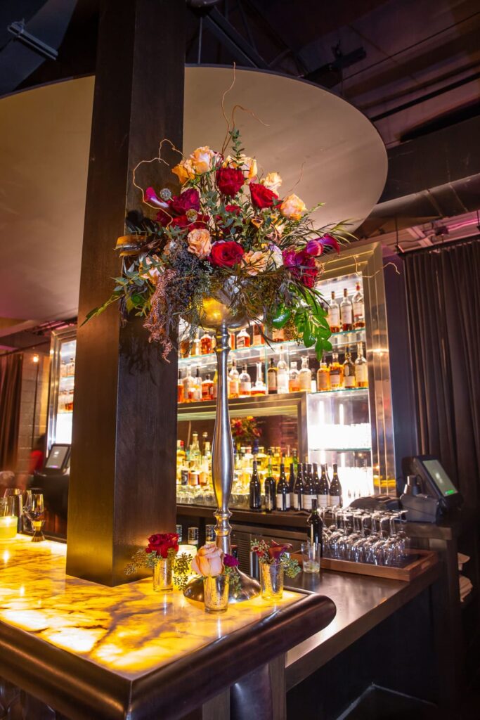 wm events, private dinner, private events, kr steakbar, floral designer, floral design, lush florals, dark and moody, red florals, red flowers, tall centerpieces, tall flower arrangements, tall floral arrangements, tablescapes, velvet linen, nbc, nbcuniversal, super bowl dinner, atlanta event planner, atlanta events, georgia events, event planning, event designer, event designing, corporate events, high end corporate