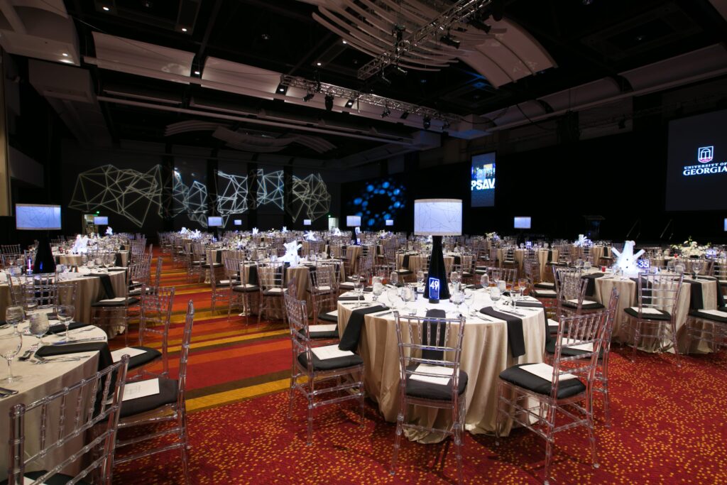 wm events, bulldog 100, university of georgia, uga, 2019 events, modern events, black and white, geometric design, event planner, event designer, hyatt regency events, atlanta events, georgia events, corporate events, social events, non-profit events, white floral, white flowers, custom centerpieces, table numbers, custom branding, ballroom, seated dinner, plated dinner