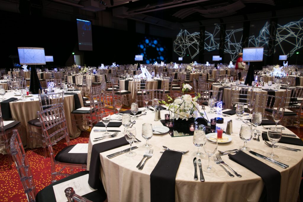 wm events, bulldog 100, university of georgia, uga, 2019 events, modern events, black and white, geometric design, event planner, event designer, hyatt regency events, atlanta events, georgia events, corporate events, social events, non-profit events, white floral, white flowers, custom centerpieces, table numbers, custom branding, ballroom, seated dinner, plated dinner