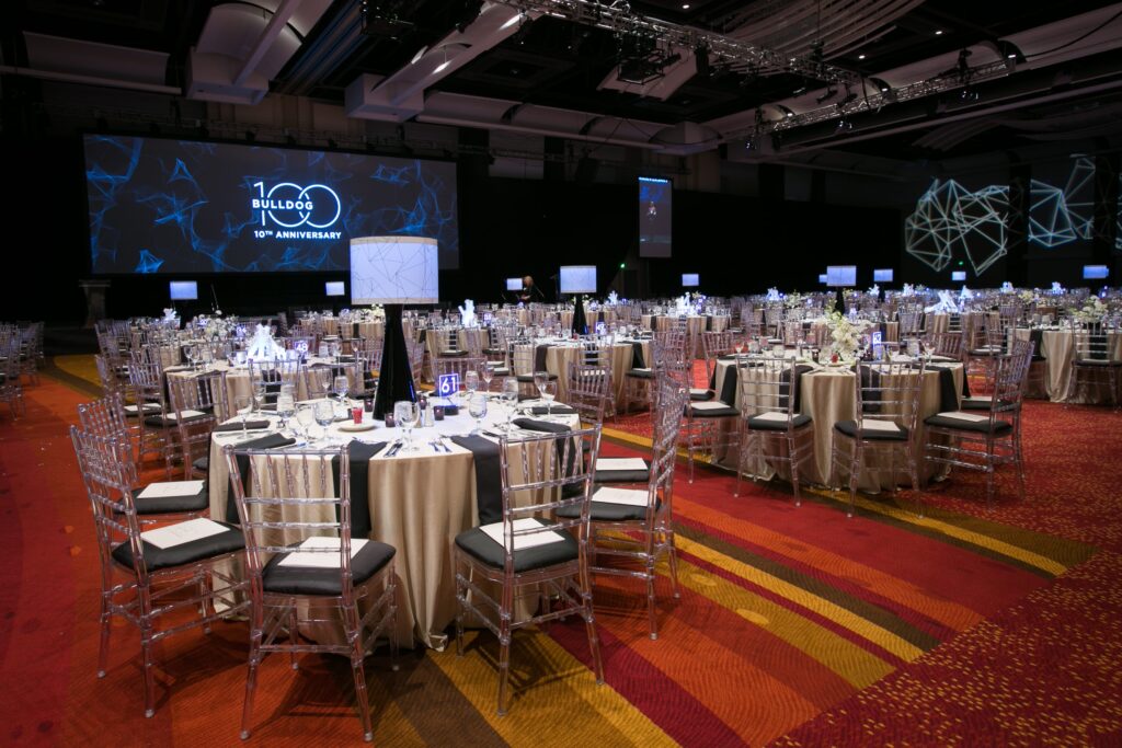 wm events, bulldog 100, university of georgia, uga, 2019 events, modern events, black and white, geometric design, event planner, event designer, hyatt regency events, atlanta events, georgia events, corporate events, social events, non-profit events, white floral, white flowers, custom centerpieces, table numbers, custom branding, ballroom, seated dinner, plated dinner